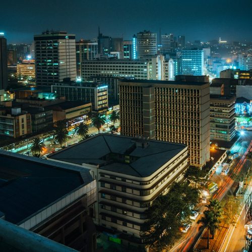 a view of a city at night from the top of a building